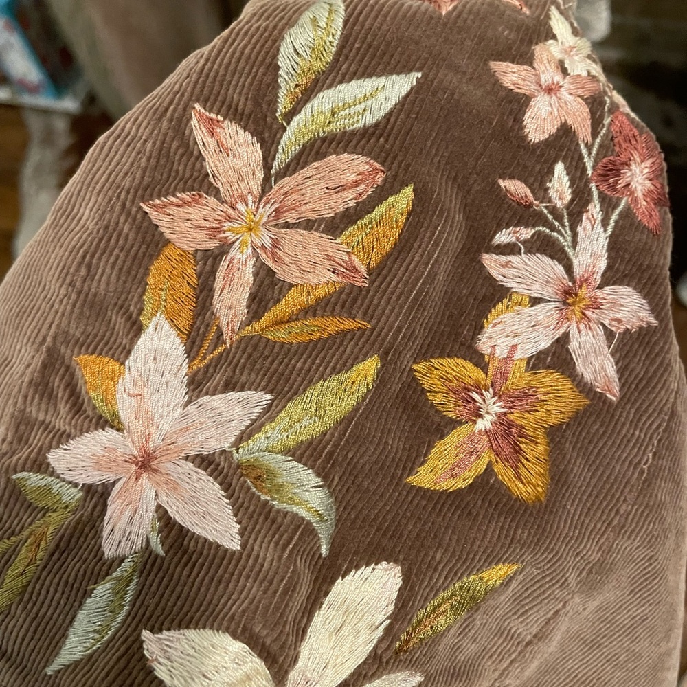Driftwood flare leg with embroidery on outer legs and back pocket
